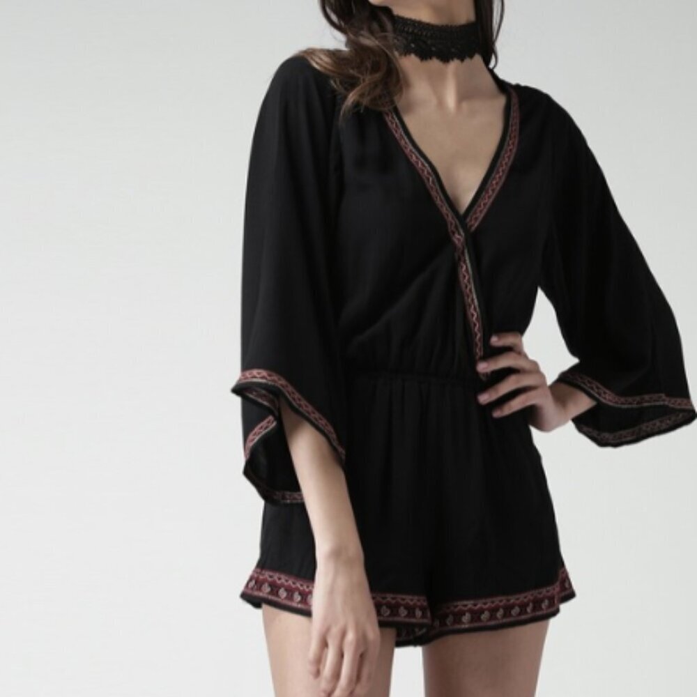 Black short romper, flowy bell sleeves with detailing all over